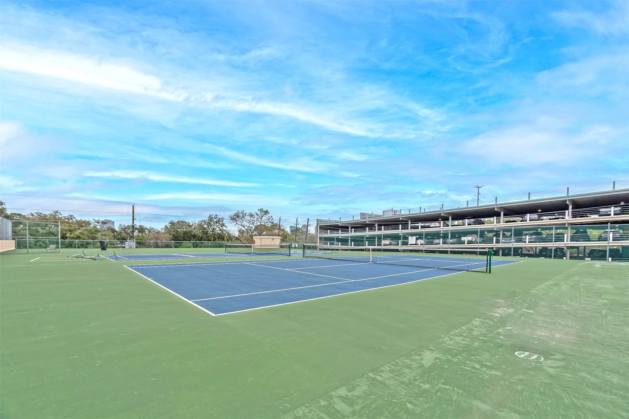 661 Bering Drive, Unit 404 Houston, TX 77057 - Photo 20 of 28 a view of a green field with clear sky