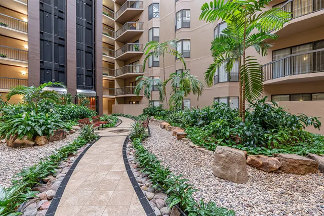 a view of a pathway both side of house