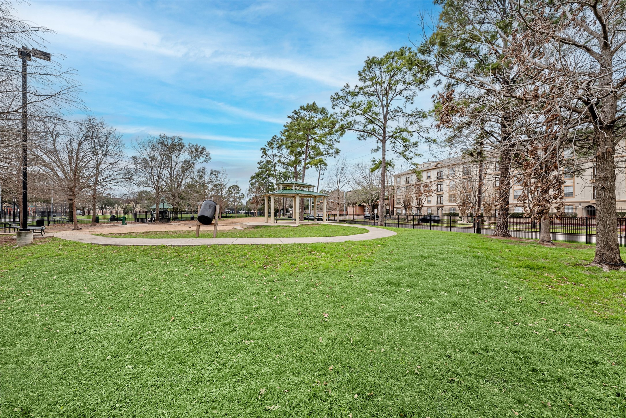 661 Bering Drive, Unit 404 Houston, TX 77057 - Photo 28 of 28 a green field with lots of trees