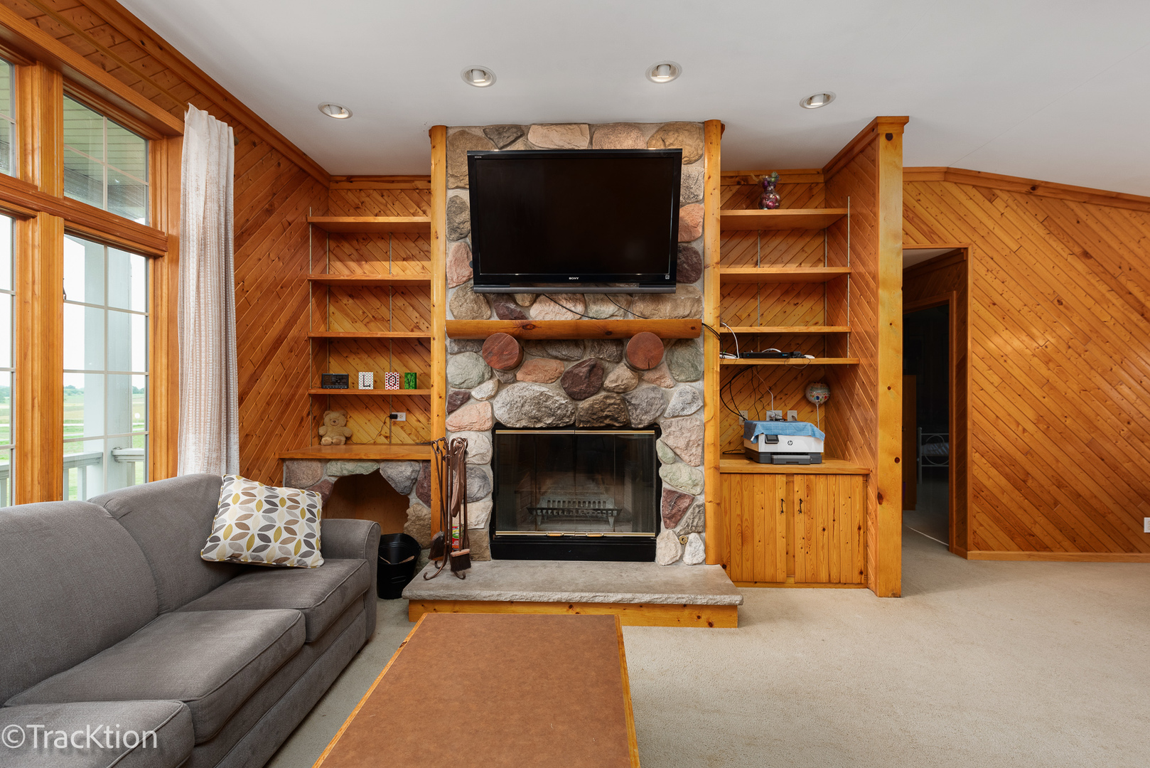 894 Moffet Road Paw Paw, IL 61353 - Photo 5 of 31 a living room with furniture a flat screen tv and a fireplace