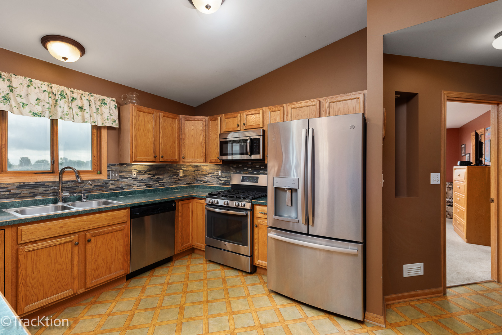 894 Moffet Road Paw Paw, IL 61353 - Photo 9 of 31 a kitchen with stainless steel appliances granite countertop a refrigerator sink and stove