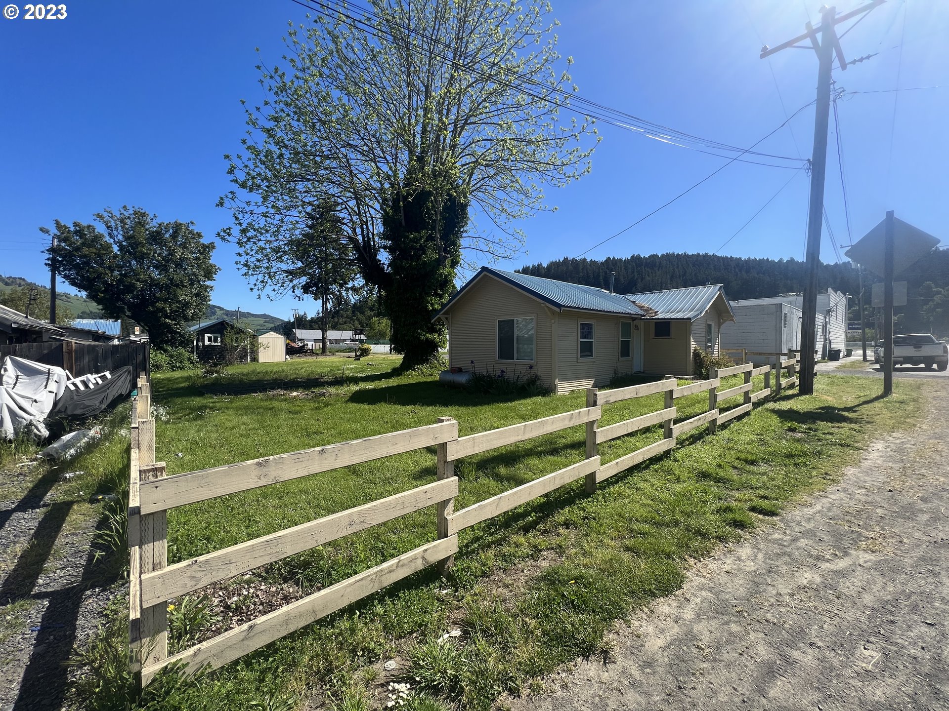 141 Poplar Street Powers, OR 97466 - Photo 12 of 14 a front view of a house with a yard