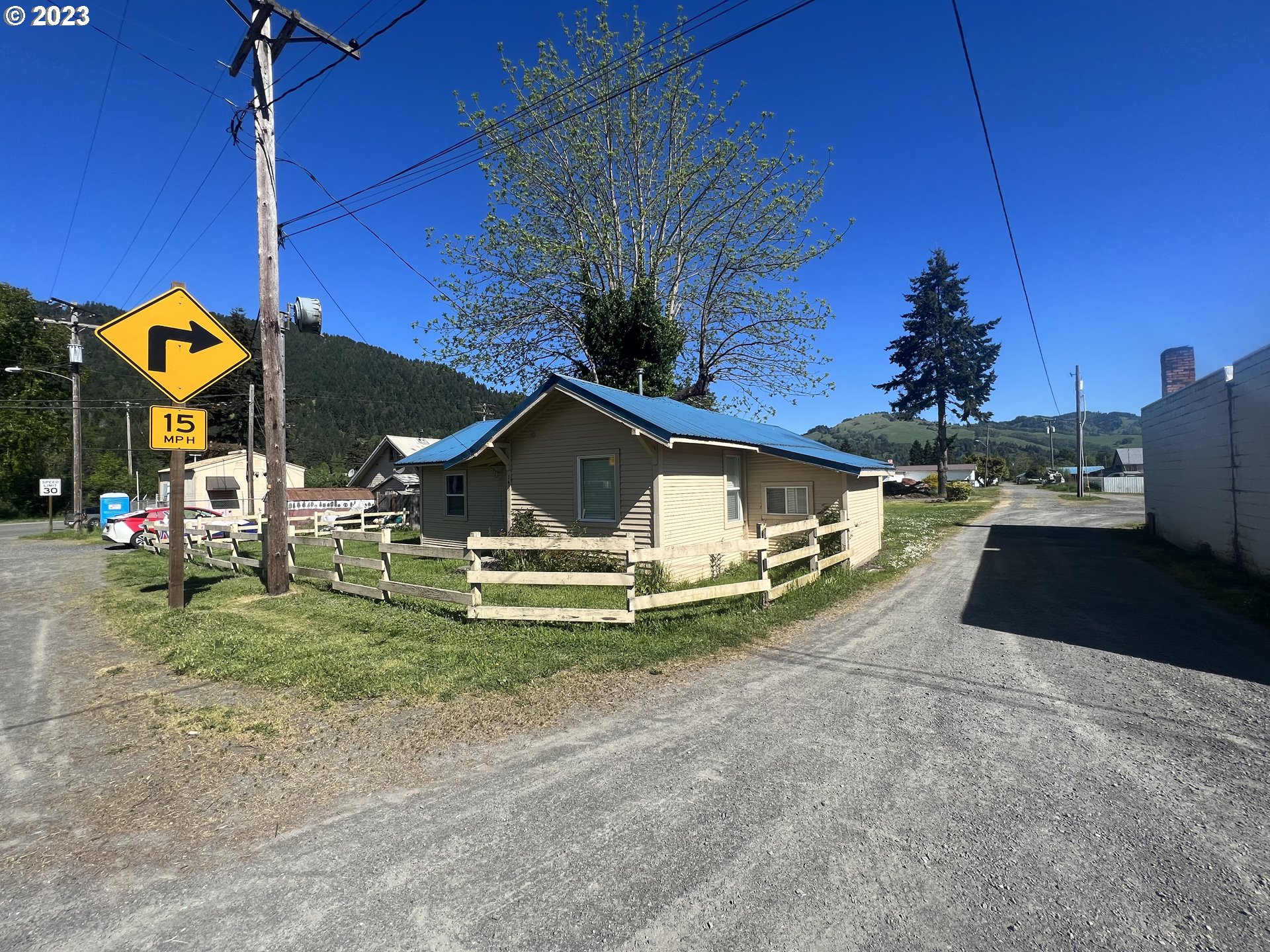 141 Poplar Street Powers, OR 97466 - Photo 13 of 14 a view of a house with a yard