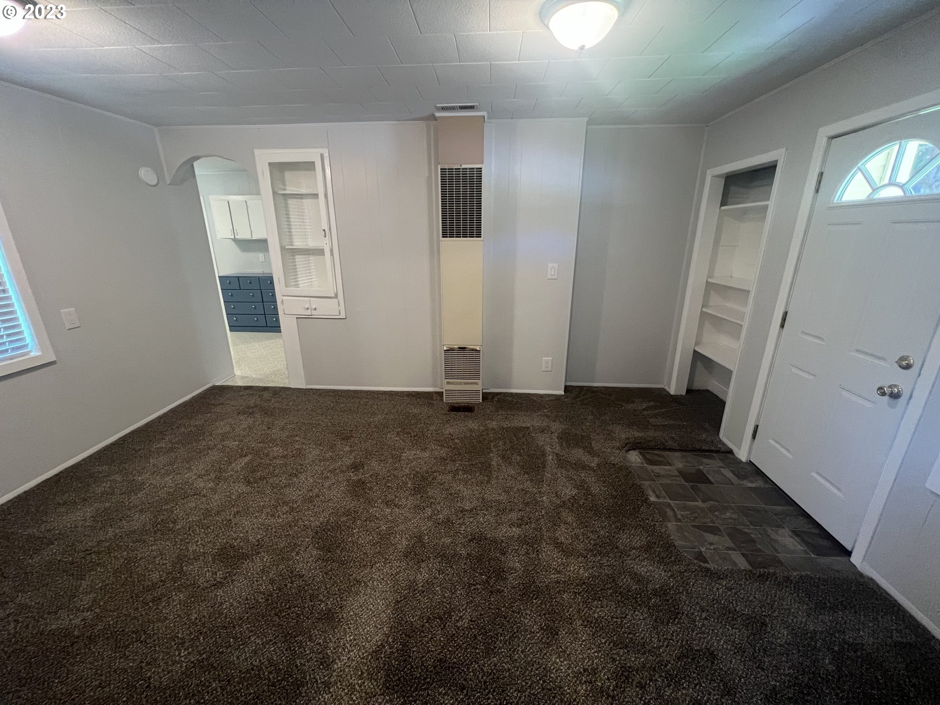 141 Poplar Street Powers, OR 97466 - Photo 2 of 14 an empty room with windows