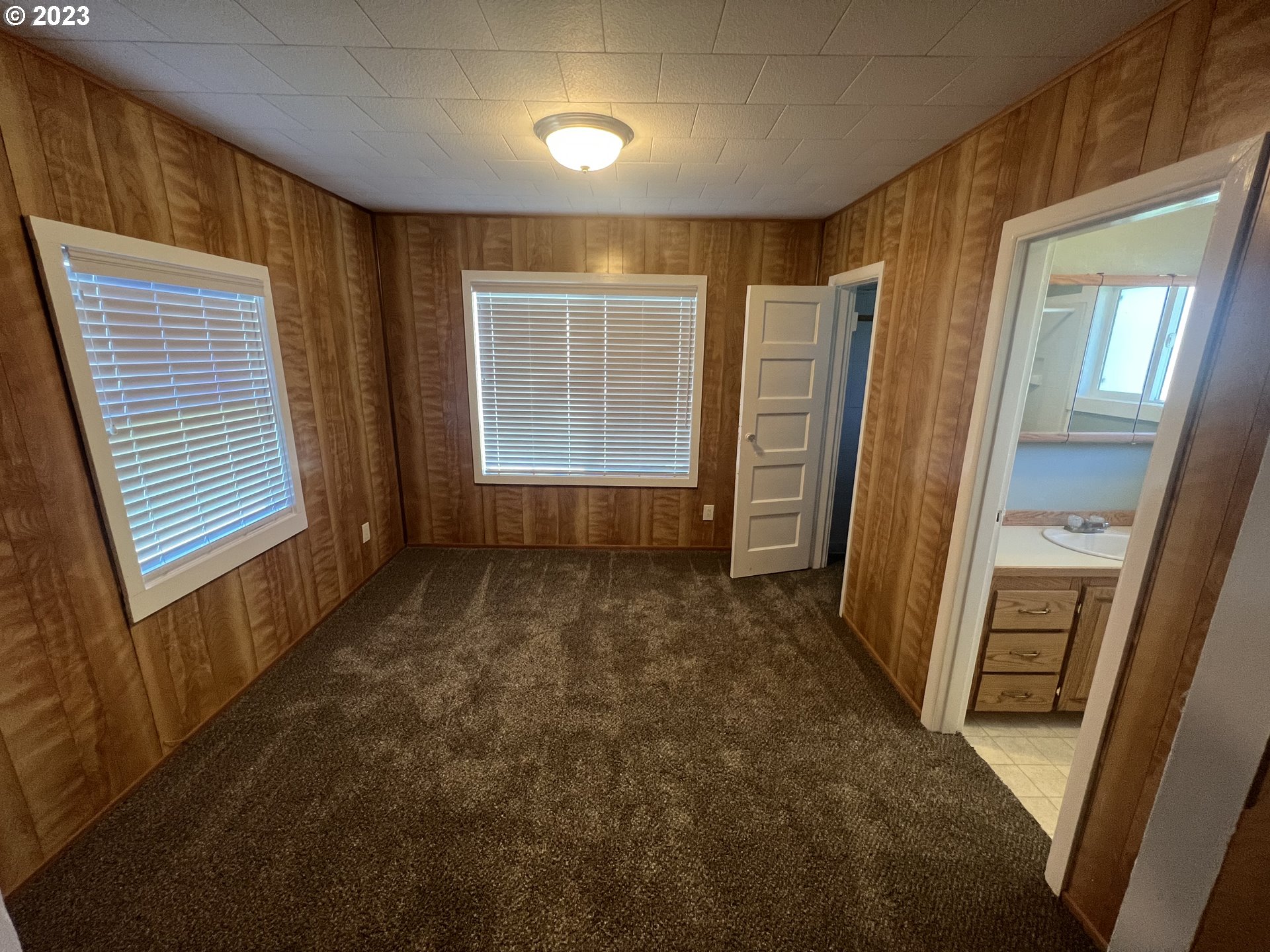 141 Poplar Street Powers, OR 97466 - Photo 3 of 14 a view of an empty room with a fireplace