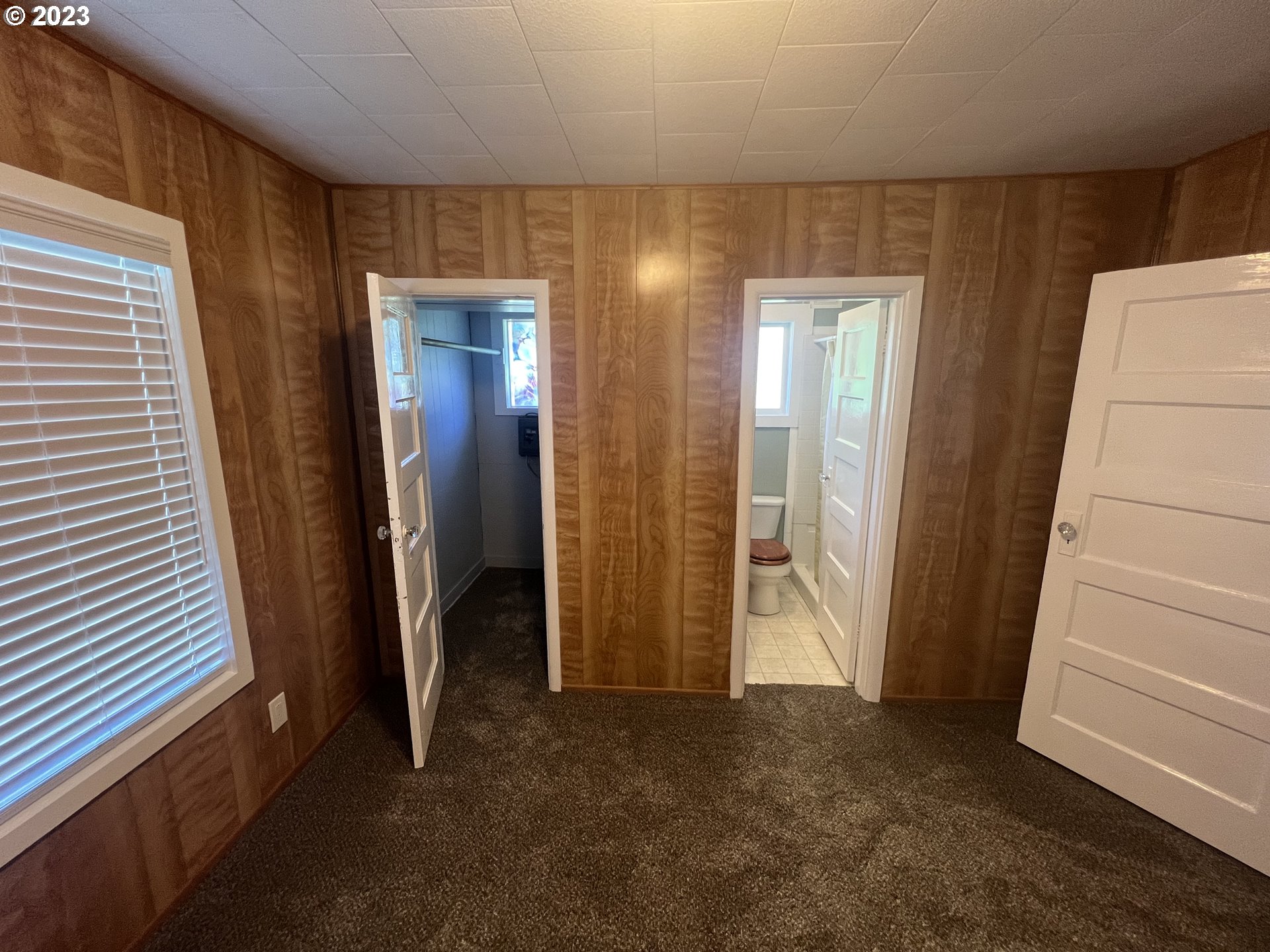 141 Poplar Street Powers, OR 97466 - Photo 8 of 14 a view of hallway with stairs and a window