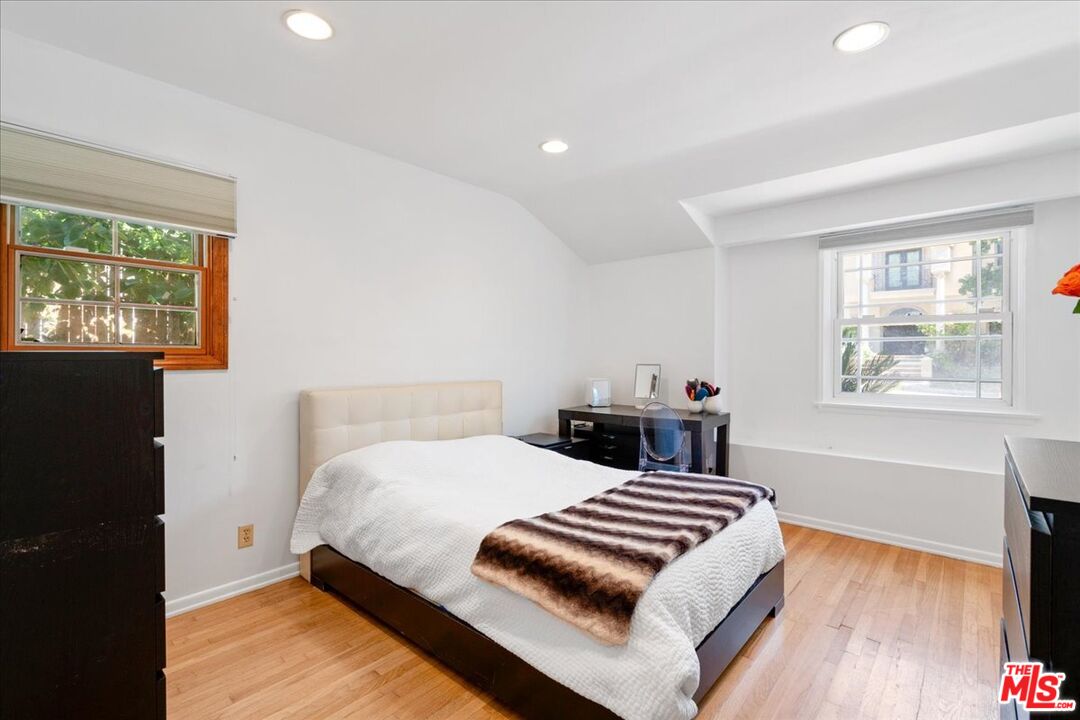2225 Roscomare Road Los Angeles, CA 90077 - Photo 20 of 28 a bedroom with a bed and a window