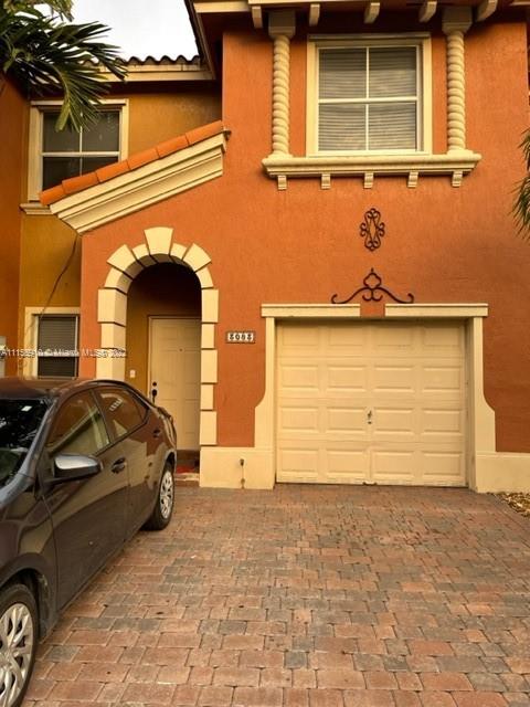 3083 Southwest 153rd Path Miami, FL 33185 - Photo 1 of 2 a front view of a house with a parking space