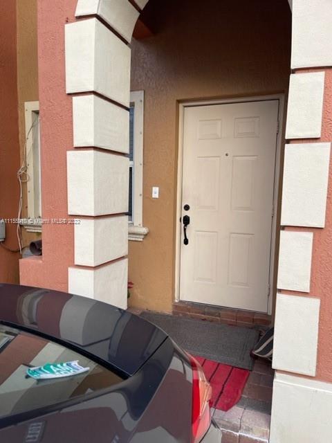 3083 Southwest 153rd Path Miami, FL 33185 - Photo 2 of 2 a bedroom with a bed and a window