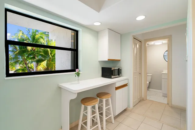 a spacious bathroom with a sink a mirror and a shower