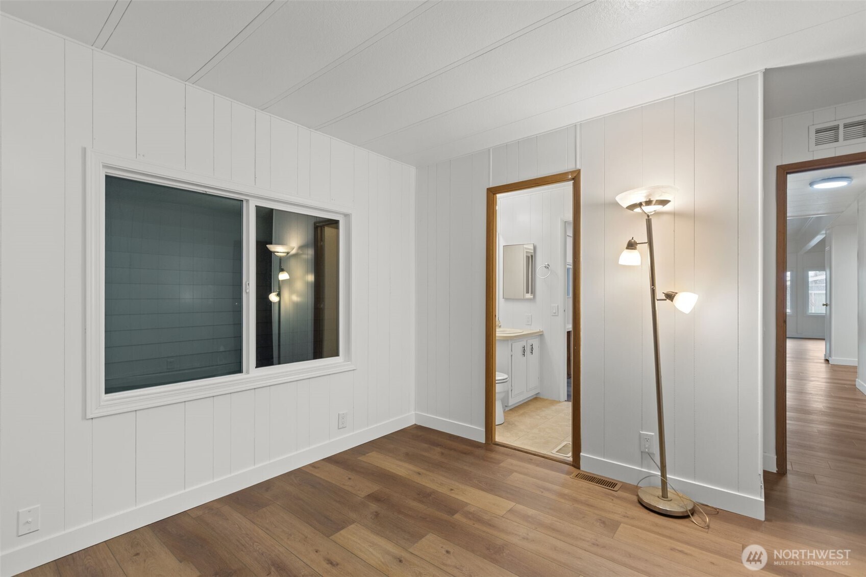 11436 Southeast 208th Street, Unit 7 Kent, WA 98031 - Photo 15 of 21 wooden floor and windows in a room
