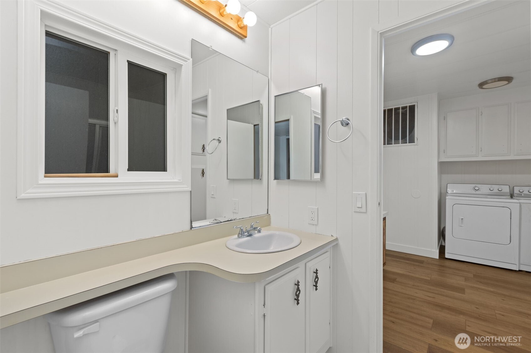 11436 Southeast 208th Street, Unit 7 Kent, WA 98031 - Photo 16 of 21 a bathroom with a sink and a mirror
