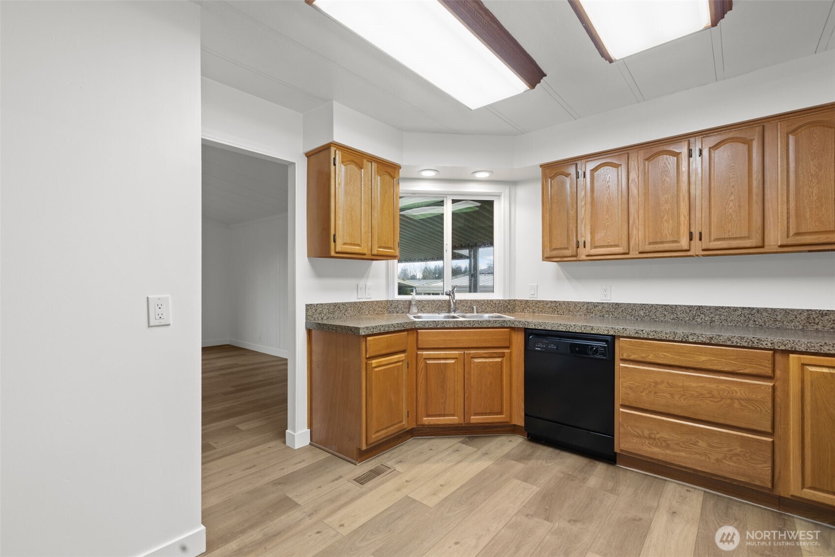 11436 Southeast 208th Street, Unit 7 Kent, WA 98031 - Photo 7 of 21 a kitchen with stainless steel appliances granite countertop a sink stove and cabinets