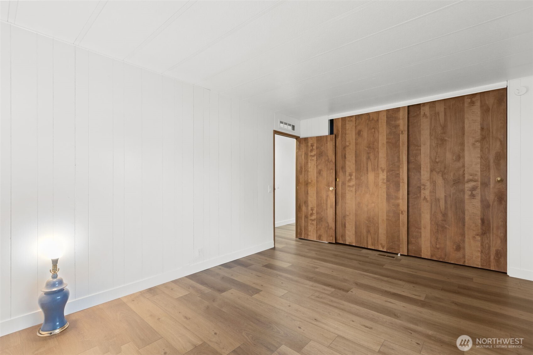11436 Southeast 208th Street, Unit 7 Kent, WA 98031 - Photo 10 of 21 a view of a room with wooden floor and brick walls