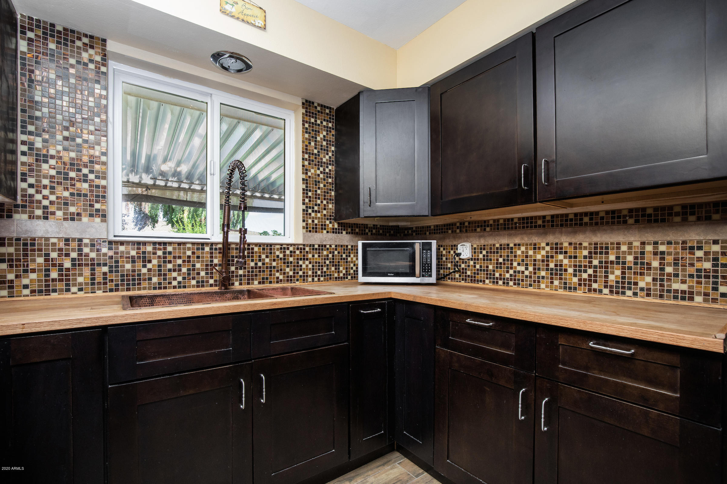 5320 East Decatur Street Mesa, AZ 85205 - Photo 15 of 34 a kitchen with a sink and cabinets