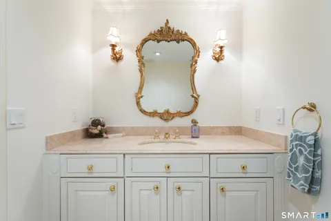 a bathroom with a sink vanity and a mirror
