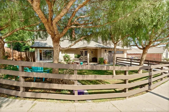 a view of a house with swimming pool and sitting area