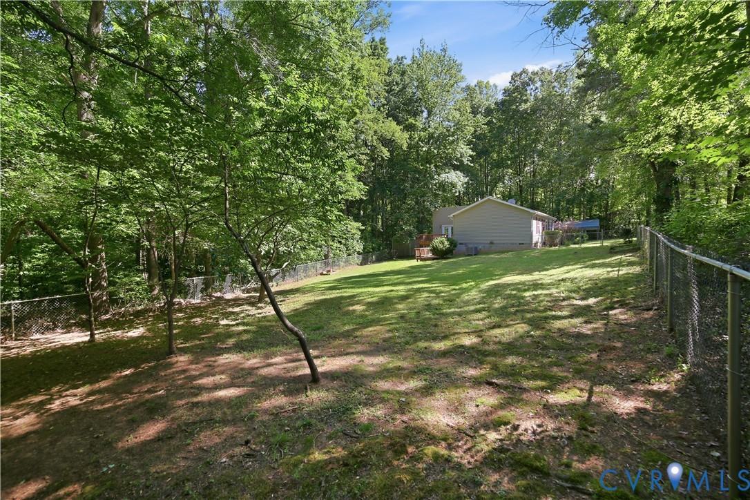 1637 Gardners Road Mineral, VA 23117 - Photo 23 of 26 Expansive, fenced backyard with a manicured lawn a
