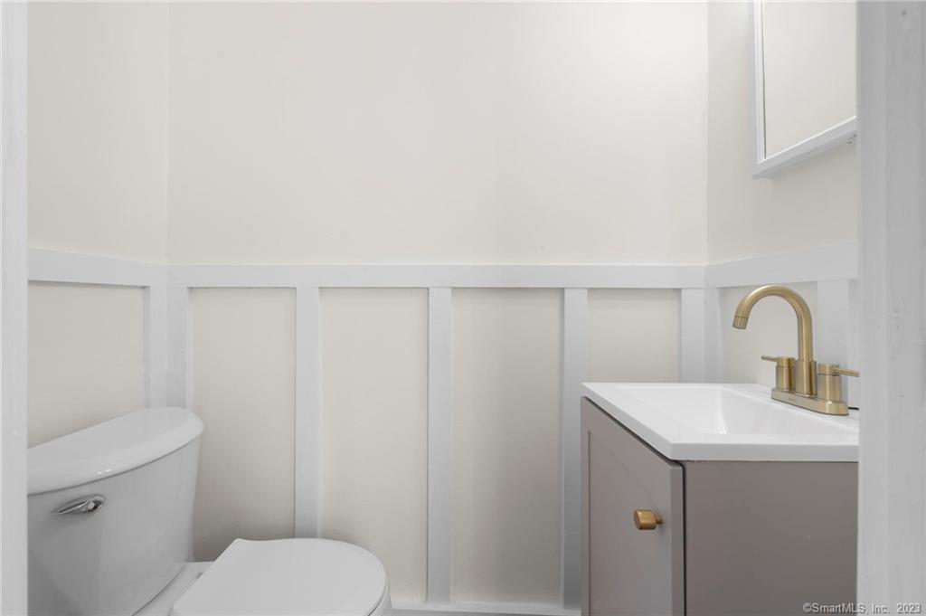 22 Sycamore Lane Waterbury, CT 06705 - Photo 11 of 31 a bathroom with a toilet sink and mirror