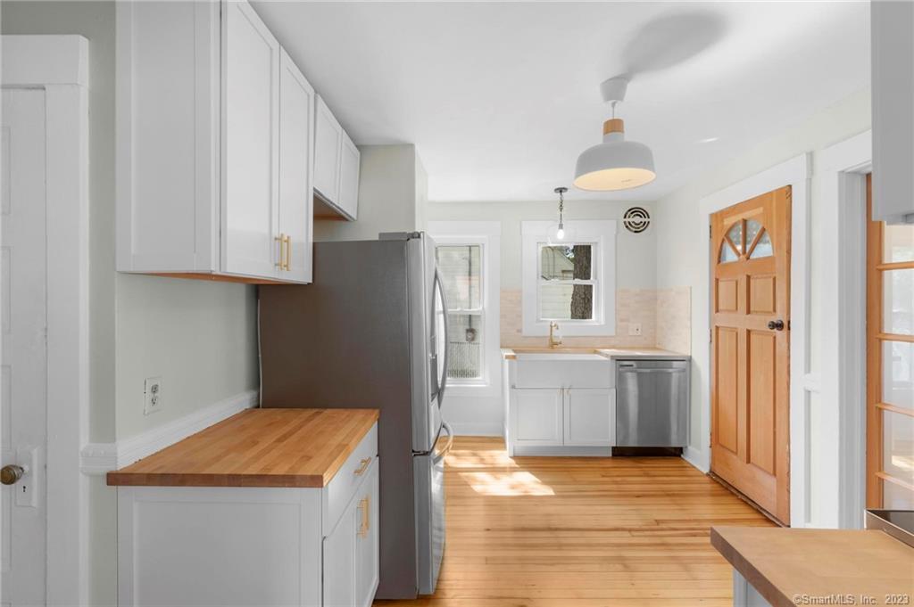 22 Sycamore Lane Waterbury, CT 06705 - Photo 12 of 31 a kitchen with a refrigerator and a sink