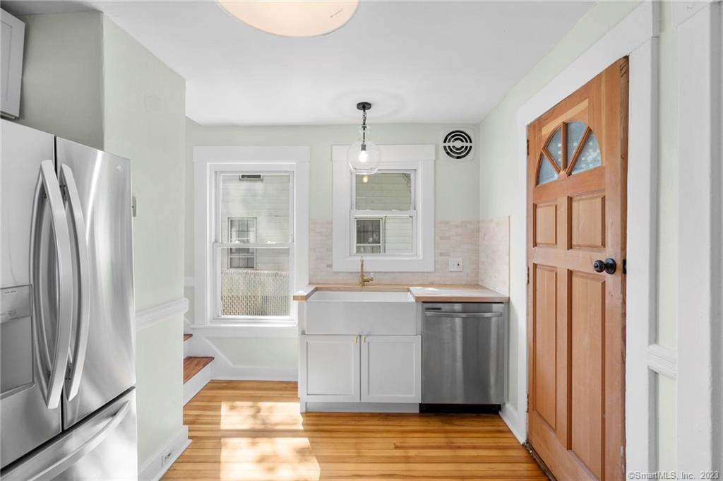 22 Sycamore Lane Waterbury, CT 06705 - Photo 14 of 31 a living room with stainless steel appliances granite countertop a refrigerator and a stove