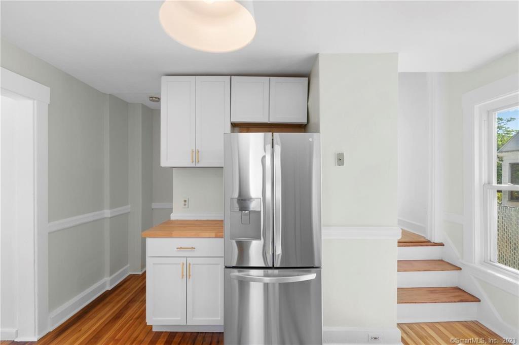 22 Sycamore Lane Waterbury, CT 06705 - Photo 16 of 31 a kitchen with a refrigerator and a sink