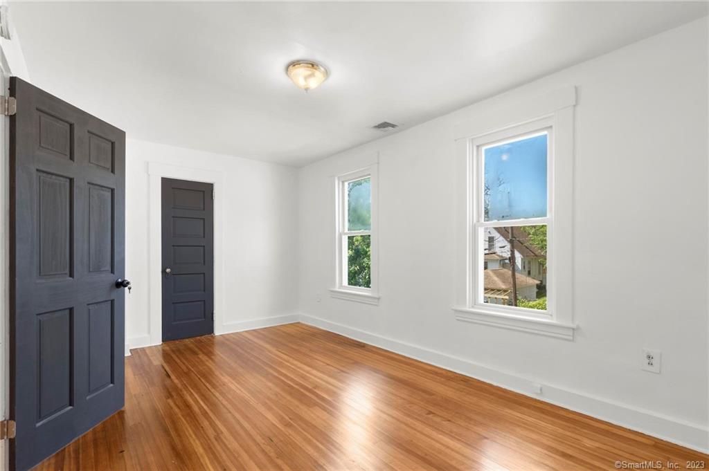 22 Sycamore Lane Waterbury, CT 06705 - Photo 22 of 31 a bedroom with a bed and a window