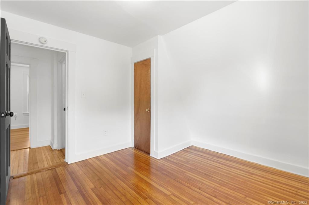 22 Sycamore Lane Waterbury, CT 06705 - Photo 29 of 31 a view of an empty room with wooden floor