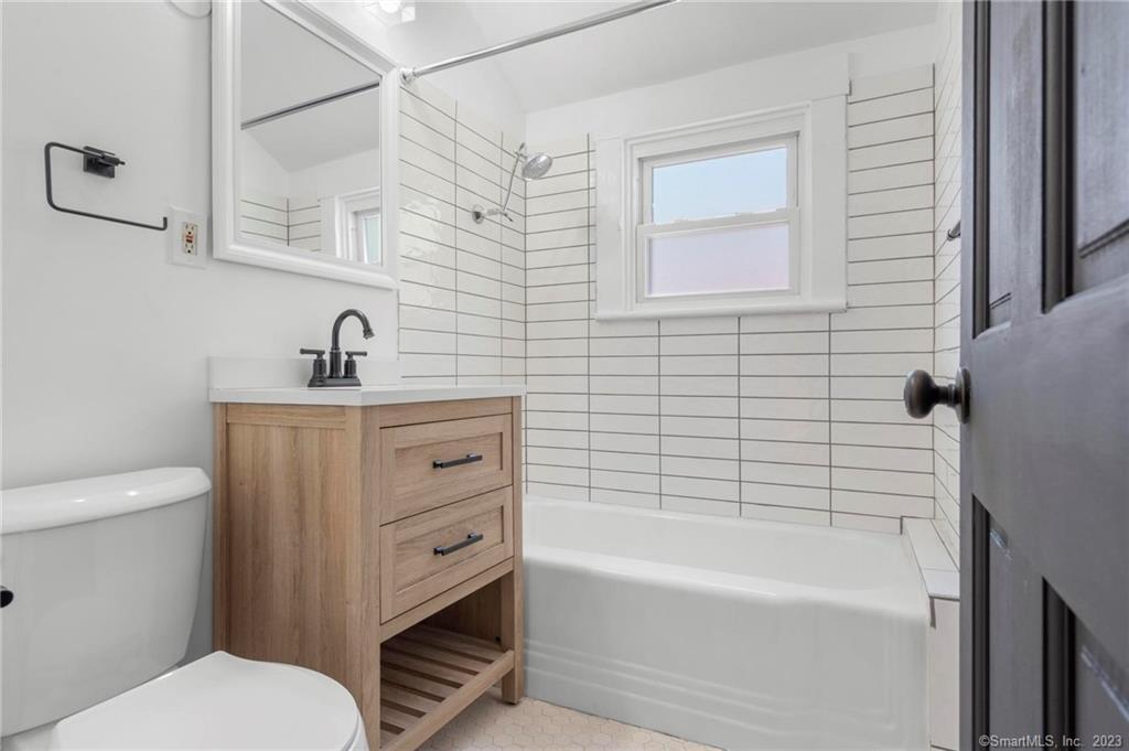 22 Sycamore Lane Waterbury, CT 06705 - Photo 30 of 31 a bathroom with a sink a toilet and bathtub