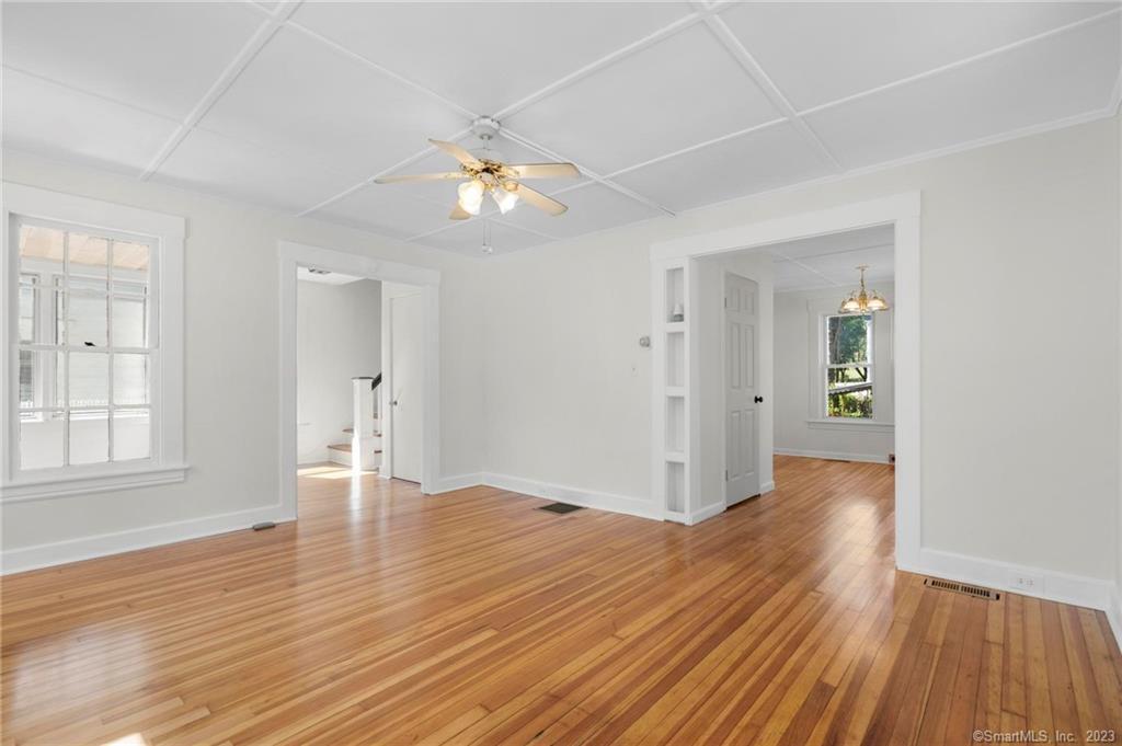 22 Sycamore Lane Waterbury, CT 06705 - Photo 5 of 31 an empty room with wooden floor and windows