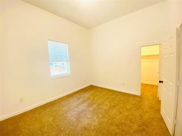 a view of walk in closet with wooden floor