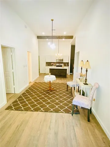 a living room with couch and a table