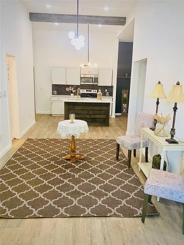 a living room with granite countertop furniture and a fireplace