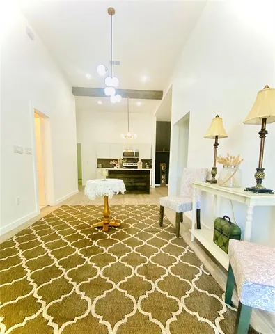 a living room with a patio and a table