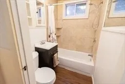 a bathroom with a sink toilet and bathtub