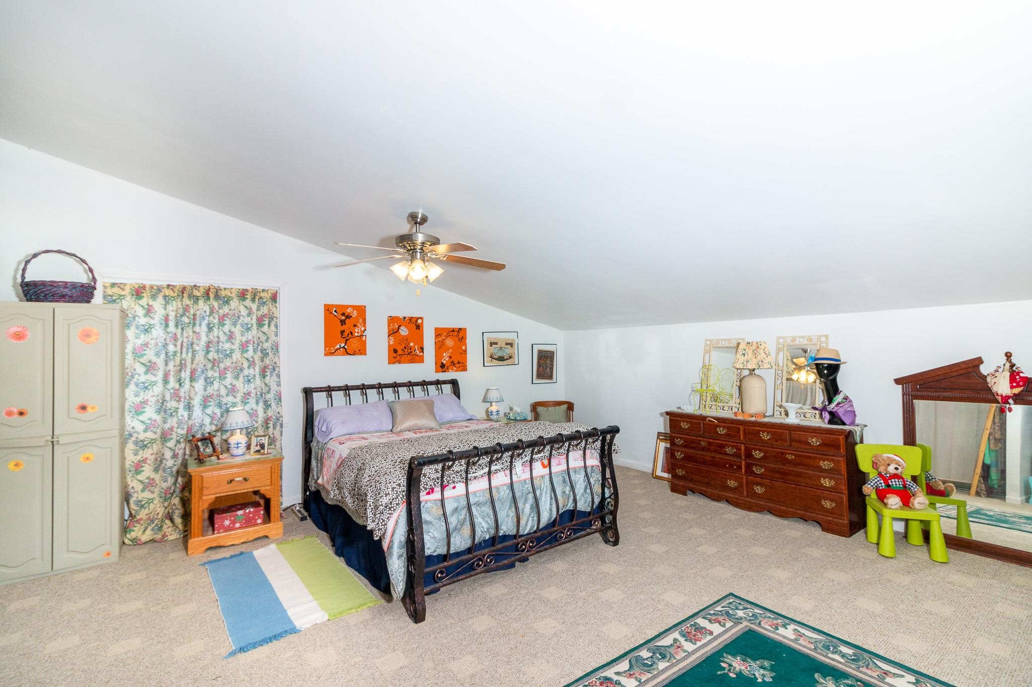 515 Blooming Grove Road Pulaski, TN 38478 - Photo 15 of 30 a bedroom with a bed and a baby crib
