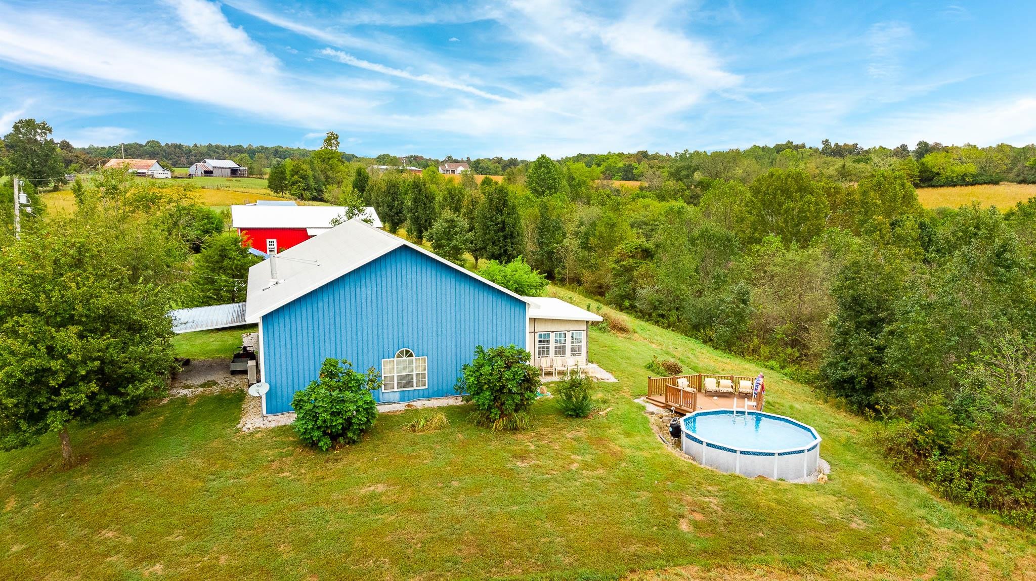 515 Blooming Grove Road Pulaski, TN 38478 - Photo 24 of 30 a view of swimming pool with a yard and mountain view in back