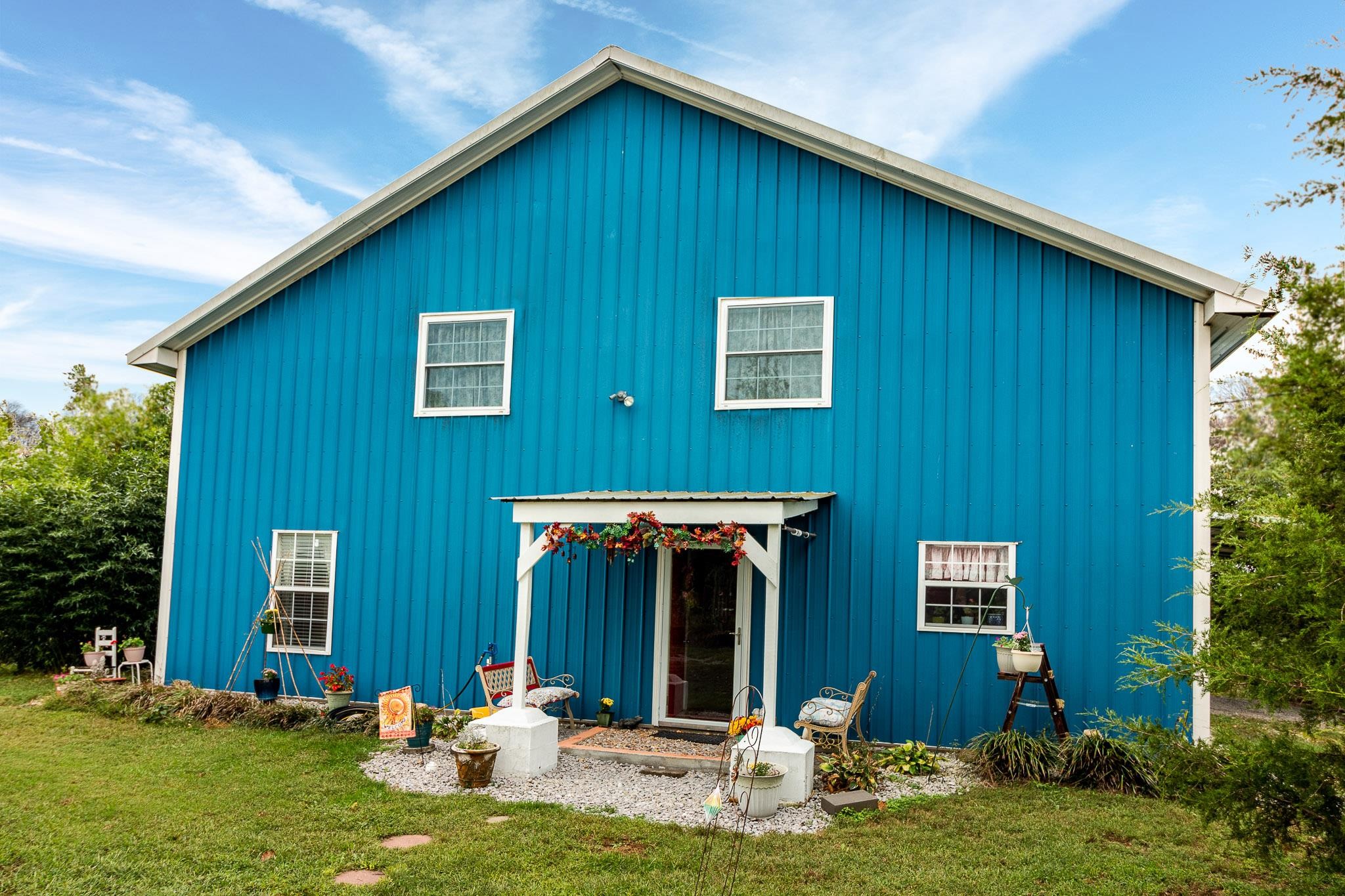 515 Blooming Grove Road Pulaski, TN 38478 - Photo 6 of 30 a backyard of a house with yard table and chairs