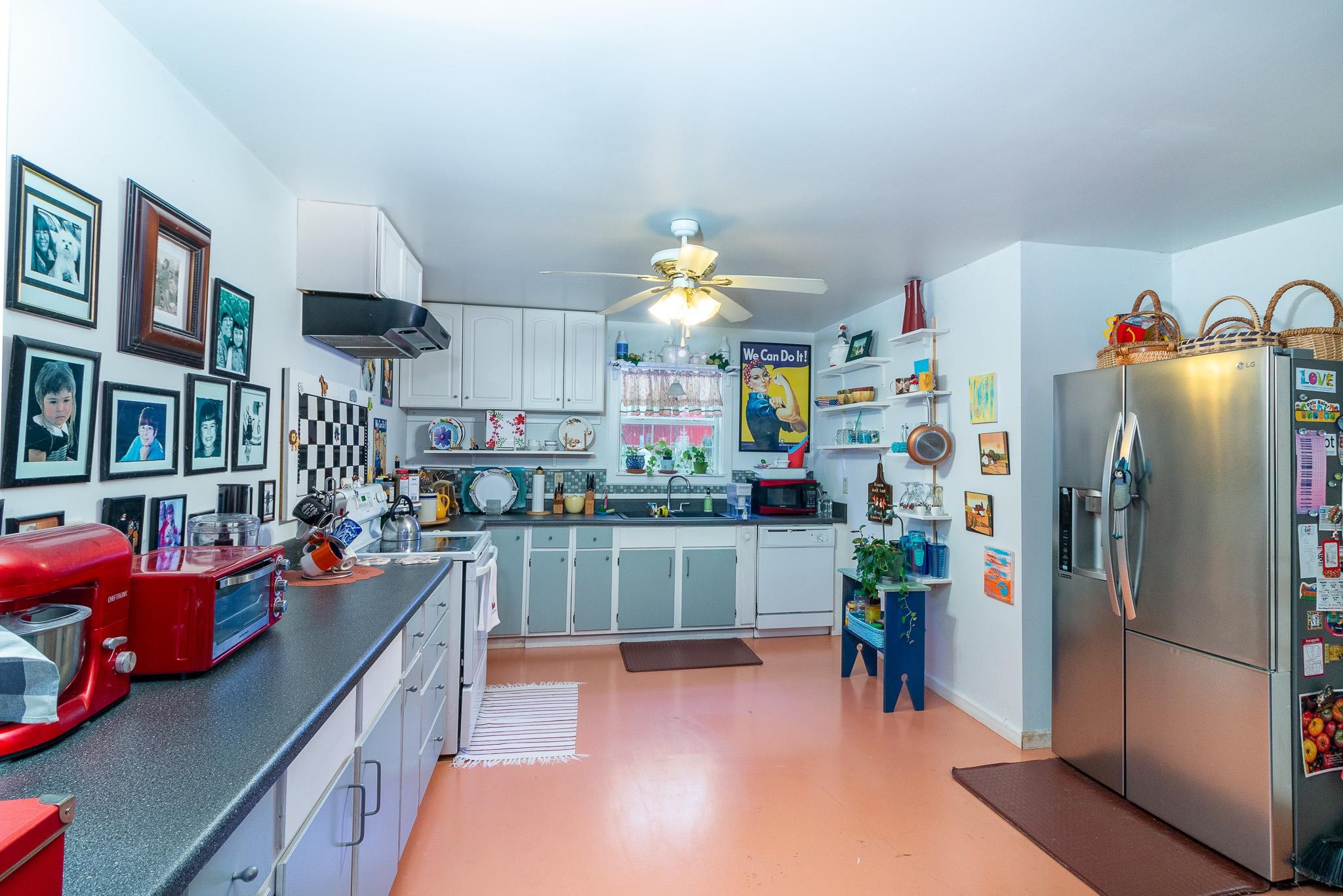 515 Blooming Grove Road Pulaski, TN 38478 - Photo 7 of 30 a kitchen filled with a refrigerator and a stove top oven