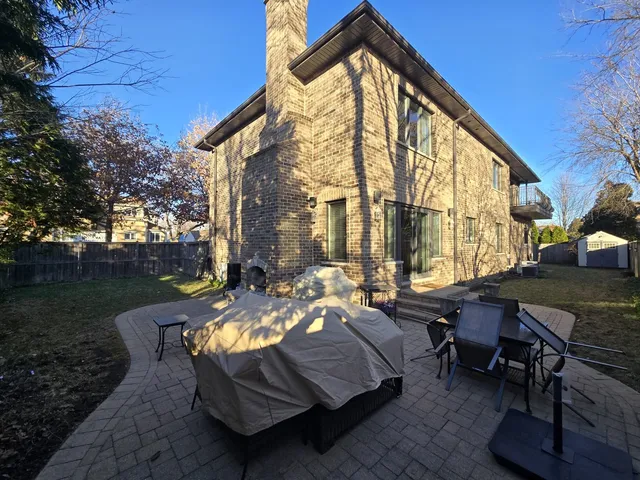 a view of a two chairs in the patio