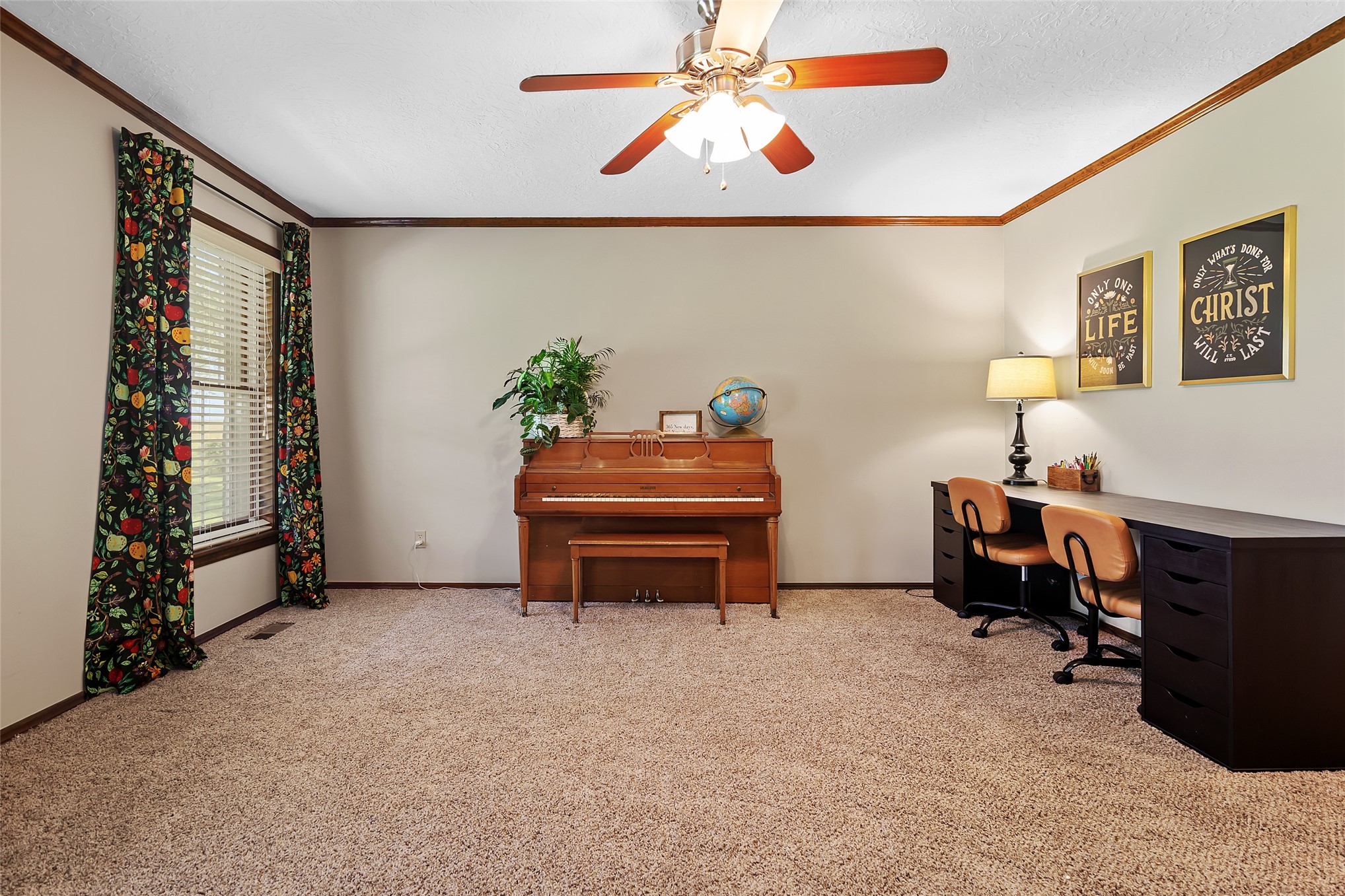 9644 19th Road Nowata, OK 74048 - Photo 11 of 36 Carpeted interior space featuring a ceiling fan with integrated lighting, crown molding, a window with blinds, and painted walls