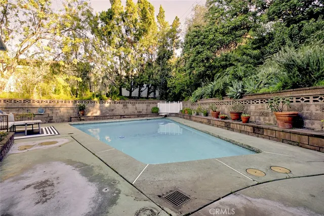 a view of a swimming pool with chairs