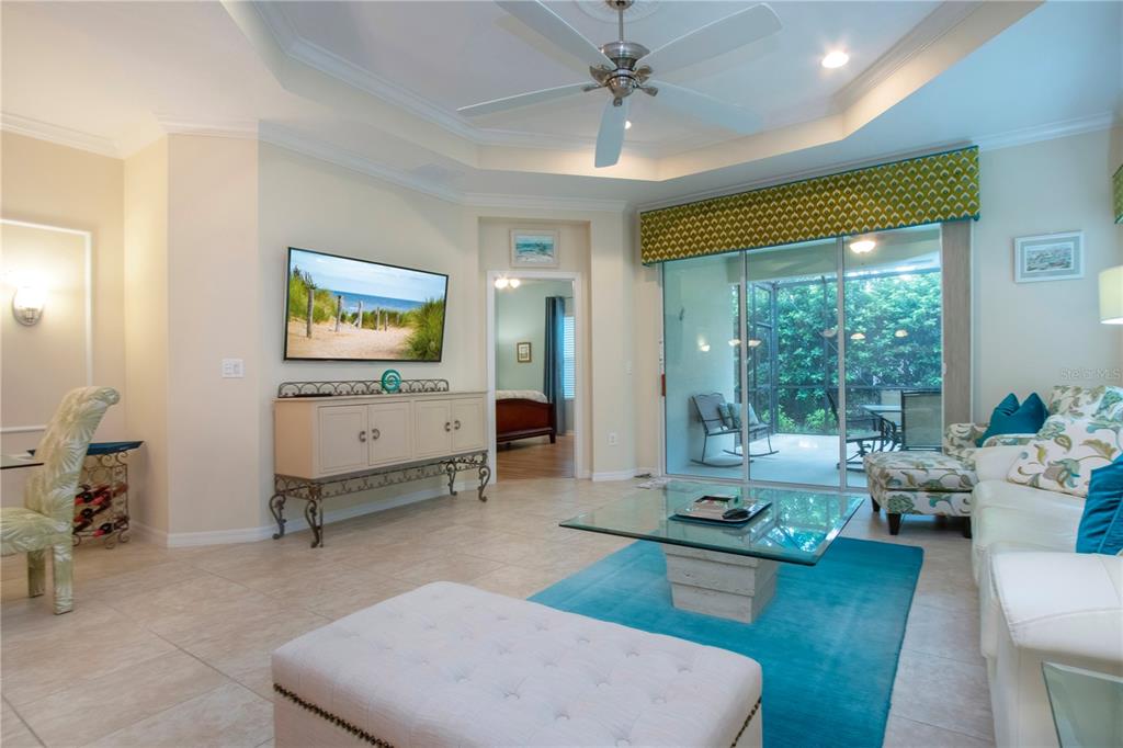 4920 Maymont Park Circle Bradenton, FL 34203 - Photo 19 of 59 a living room with furniture and a large window