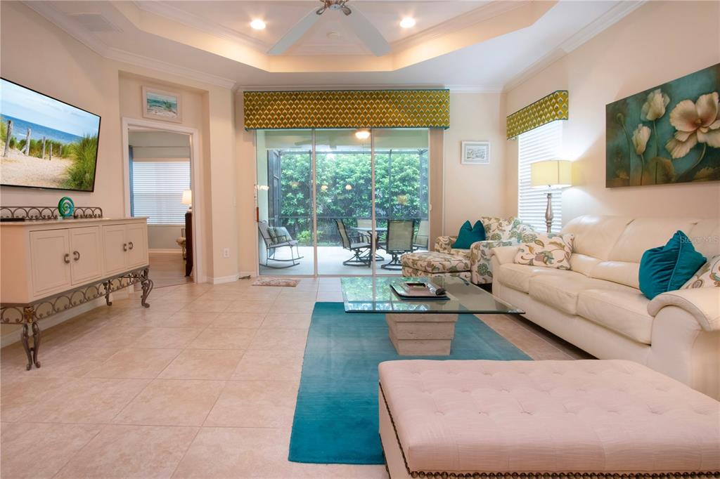 4920 Maymont Park Circle Bradenton, FL 34203 - Photo 21 of 59 a living room with furniture and a flat screen tv