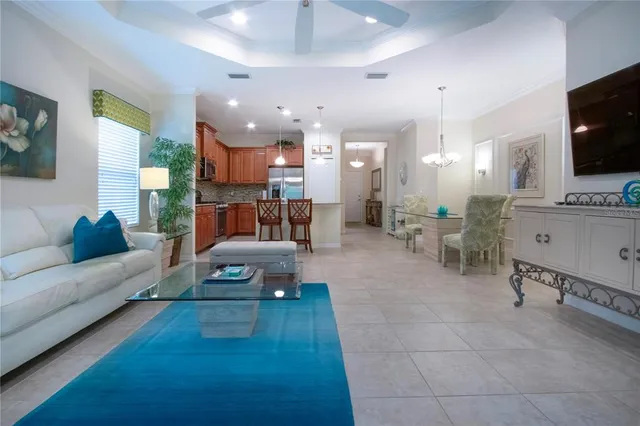 a kitchen with stainless steel appliances wooden cabinets granite counter tops and a refrigerator