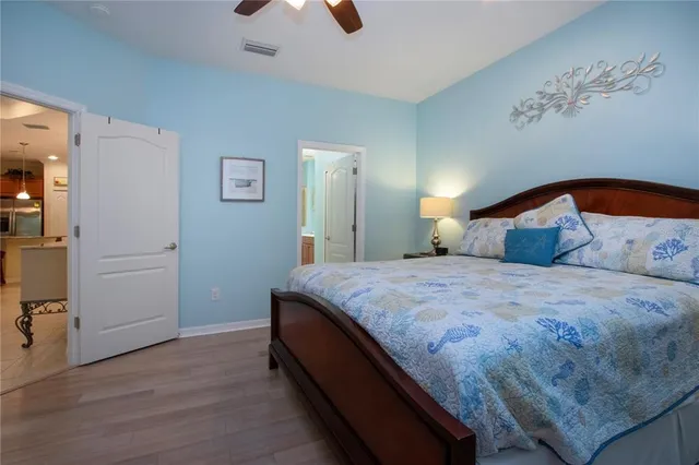 a bathroom with a double vanity sink toilet and a mirror