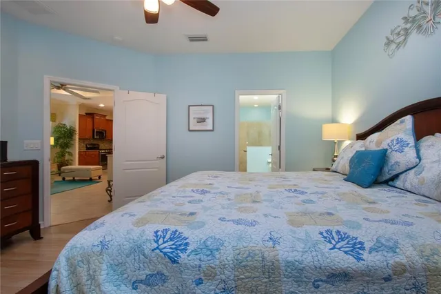 a en suite bathroom with a sink double vanity and a mirror