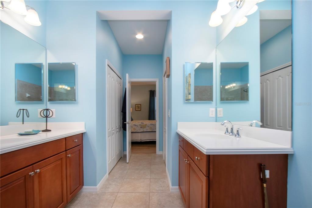 4920 Maymont Park Circle Bradenton, FL 34203 - Photo 46 of 59 a en suite bathroom with a sink double vanity and a mirror