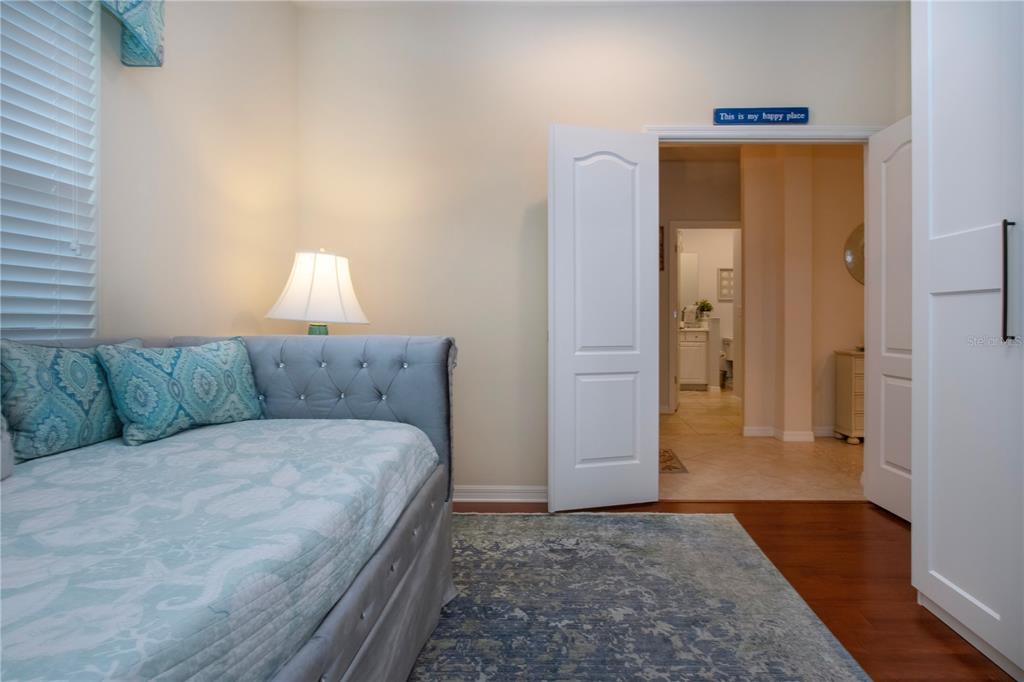 4920 Maymont Park Circle Bradenton, FL 34203 - Photo 49 of 59 a living room with a bed and a couch