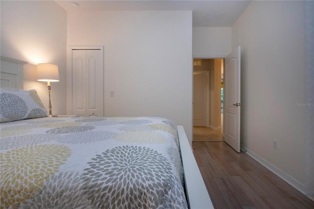 4920 Maymont Park Circle Bradenton, FL 34203 - Photo 52 of 59 a bedroom with a bed and a mirror